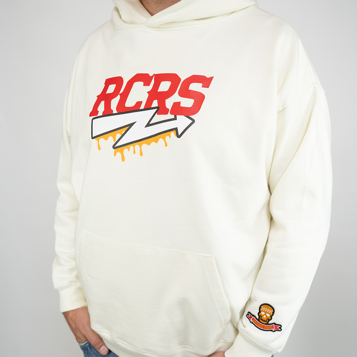 Racing Relics RCRS hoodie in off-white – oversized 420g organic cotton hoodie with embroidered sleeve patch and bold RC Racing System logo