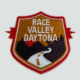 Embroidered Racing Relics “Race Valley Daytona” patch featuring a desert road and mountain backdrop in red, gold, and black.